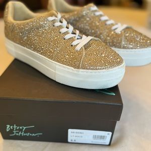 Betsy Johnson light gold sparkly sneakers.